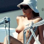 Monica Bellucci topless at the beach 1