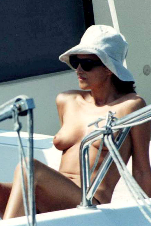 Monica Bellucci topless at the beach