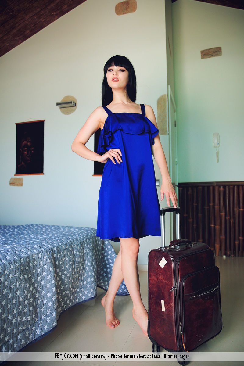 Malena F. strips from blue satin dress while on vacation